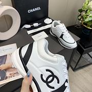 Chanel Women's Black and White Low Top Logo Sneaker - 4
